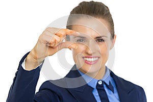 Closeup on business woman showing little risks