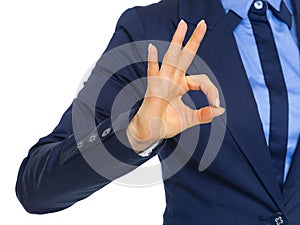 Closeup on business woman showing ok gesture