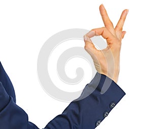 Closeup on business woman showing ok gesture