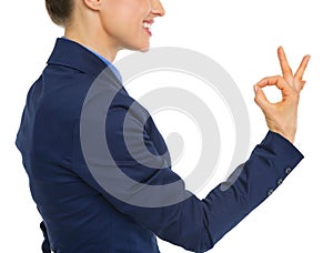 Closeup on business woman showing ok gesture