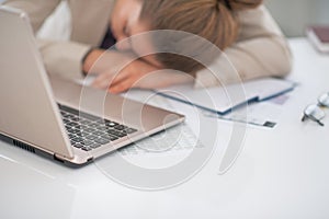 Closeup on business woman sleeping at desk