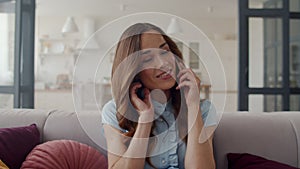 Closeup business woman talking friendly on cell phone at home office.