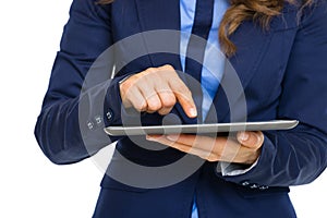 Closeup on business woman working on tablet pc