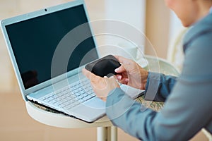 Closeup on business woman writing sms on terrace