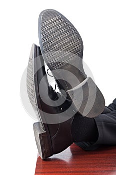 Closeup of businessman feet with leather shoes