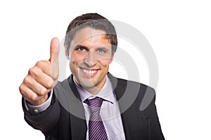 Closeup of a businessman gesturing thumbs up