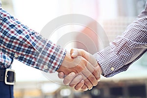 Closeup of a businessman hand shake between two colleagues  OK, succeed in business Holding hands.