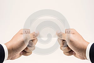 Closeup businessman hand wearing suit showing blank paper card