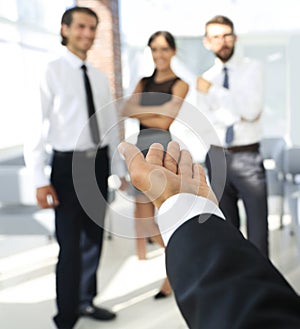 Closeup. businessman holding out hand for a handshake.