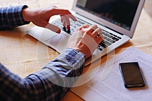 Closeup of businessman is keyboarding on portable net-book