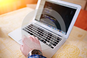 Closeup of businessman is keyboarding on portable net-book