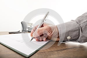 Closeup of businessman or lawyer signing an important contract,