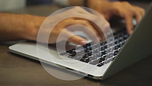 Closeup of businessman typing on laptop computer