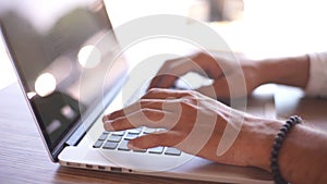 Closeup of businessman typing on laptop computer