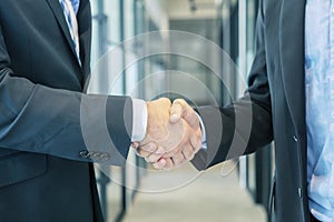 Closeup of businessmen shaking hands