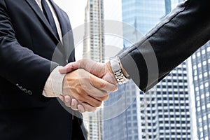 Closeup businessmen shaking hands