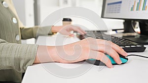 Closeup businesswoman hand use mouse and keyboard for summary project presentation on white desk before conference in meeting room