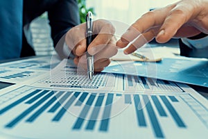 Closeup busy analyst team discussing financial data on laptop. Fervent