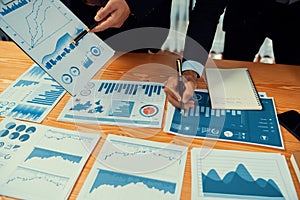 Closeup busy analyst team discussing financial data on laptop. Fervent