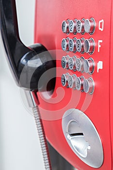 Closeup buttons of the red public telephone. Selective focus