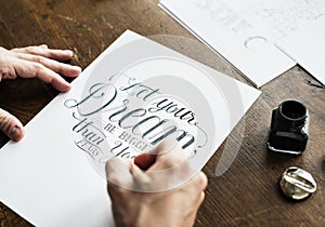 Closeup of a calligrapher working on a project