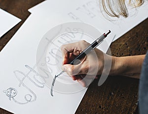 Closeup of a calligrapher working on a project photo