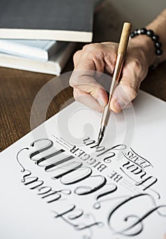 Closeup of a calligrapher working on a project
