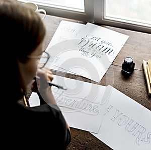 Closeup of a calligrapher working on a project