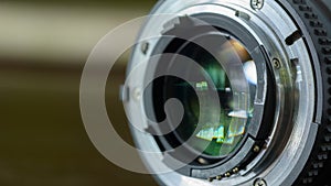 Closeup camera lens on blurred background