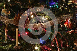 Closeup of a candle and other Decorations on a Christmas Tree