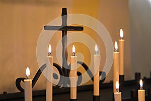 Closeup of candles and crucifix, Rupert Mayer Church Unterkirche in Citizen`s Hall Church BÃ¼rgersaalkirche Munich MÃ¼nchen, B