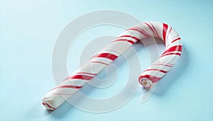 Closeup of a candy cane on a light blue background