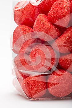 Closeup on candy strawberries in luxury plastic bag