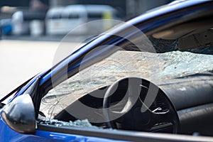Closeup of car with broken windshield, damaged automobiles