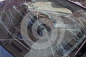 Closeup of car with broken windshield, Terrible dangerous car after a fatal accident. Broken windshield