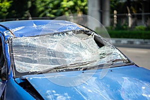 Closeup of car with broken windshield, Terrible dangerous car after a fatal accident. Broken windshield. A broken car with broken