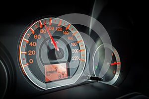 Closeup car dashboard. Speeding on 80 km per hour.