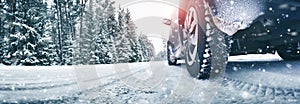 Closeup of car tires in winter on the road