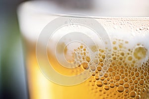 closeup of carbonation bubbles in a glass of beer