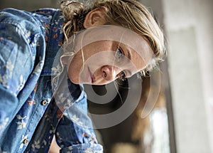 Closeup of Caucasian woman working face thoughtful expression