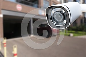 Closeup CCTV camera monitoring in the cars park. An automated car parking system.