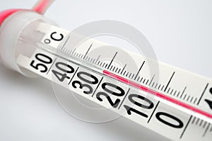 Closeup of celsius thermometer. Small DOF