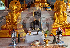 Closeup of central statues in Main Prayer Hall of Wang Saen Suk monastery, Bang Saen, Thailand