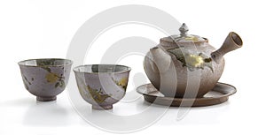 Closeup of ceramic teapot and teacup set Japanese style isolated on white background