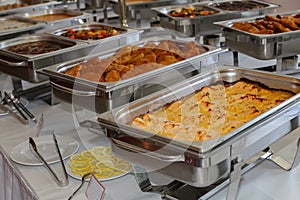 Closeup of chafing dishes at a party