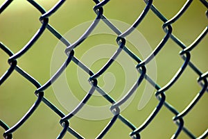 Closeup of a Chain-Linked Fence at a Baseball Game