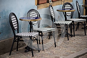 chairs and table at the restaurant terrasse in the street