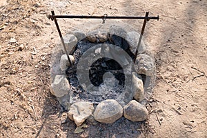 Closeup of charcoal in grill with grate