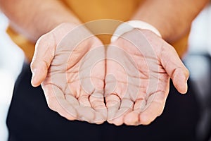 Closeup, charity and hands for begging, help and community with support, kindness and compassion. Zoom, hand and palms