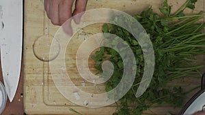 Closeup of chef hands shredding garlic on a grater